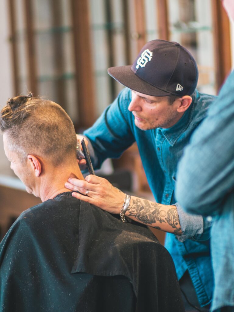 Premium Barber Services in Flagstaff Arizona, A Man Is Getting a Hair Cut and a hot towel shave At The Urban Shave